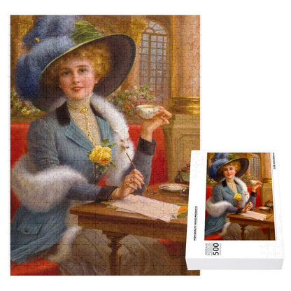 From Paris with Love by Emile Vernon, Undated. Jigsaw Puzzle. A Parisian woman dressed in an elegant jacket with matching feathers in her wid brim hat, is having tea and catching up on her correspondance. AHomespunHobby.com